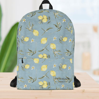 Backpack with lemon and floral pattern on a light blue background