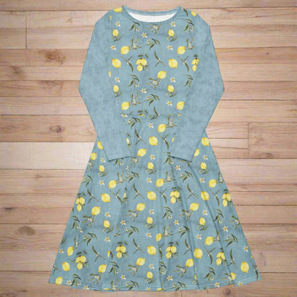 Blue dress with lemon pattern on a wooden surface