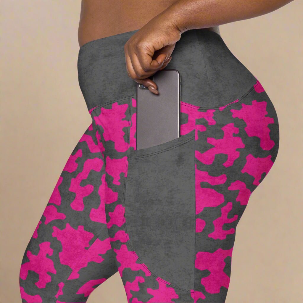 Gray leggings with pink camouflage pattern on a beige background