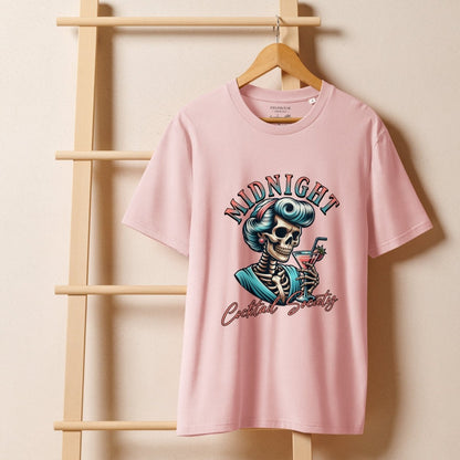 Pink t-shirt with skeleton graphic and text on a wooden hanger against a beige background