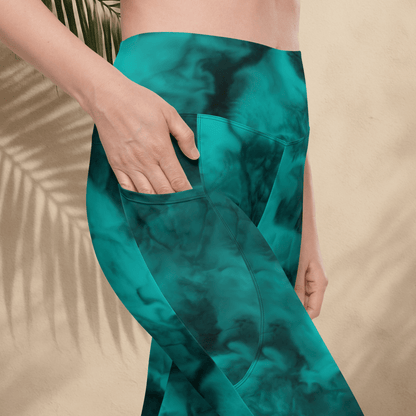 Teal tie-dye pants with a beige background