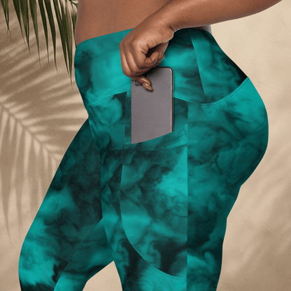 Teal patterned pants worn by a person against a beige background