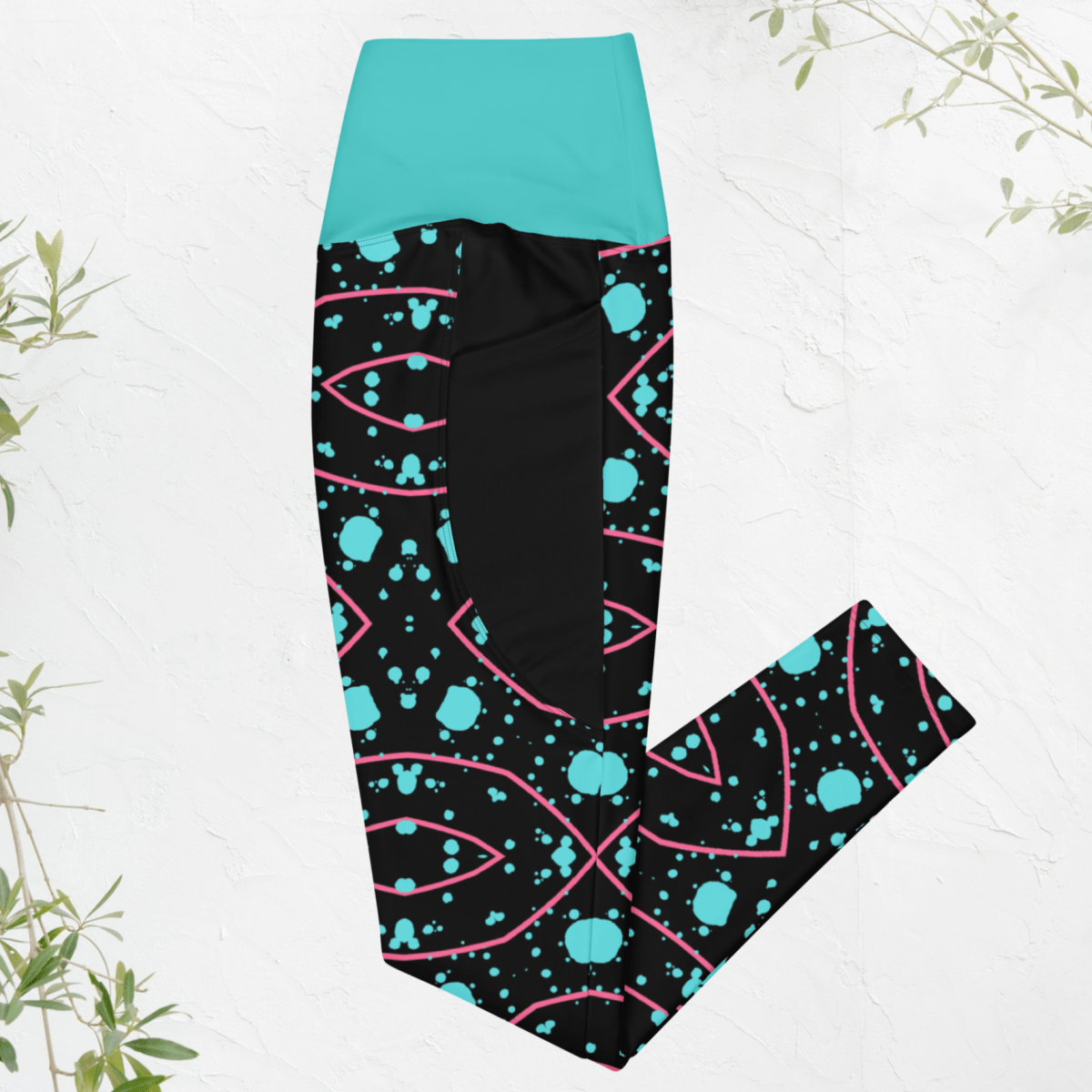 Leggings with a black, blue, and pink pattern on a white background