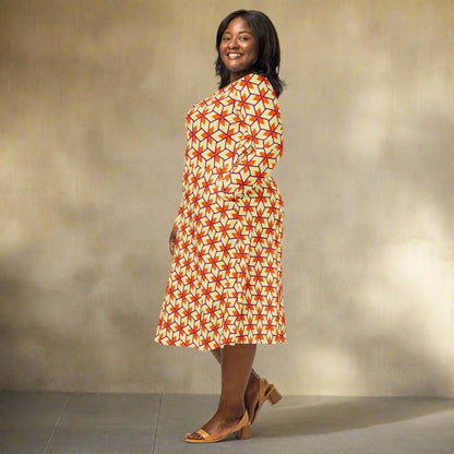 Woman wearing a patterned dress on a neutral background