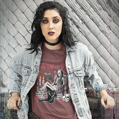 Person wearing a graphic t-shirt with a skeleton design against a textured wall.
