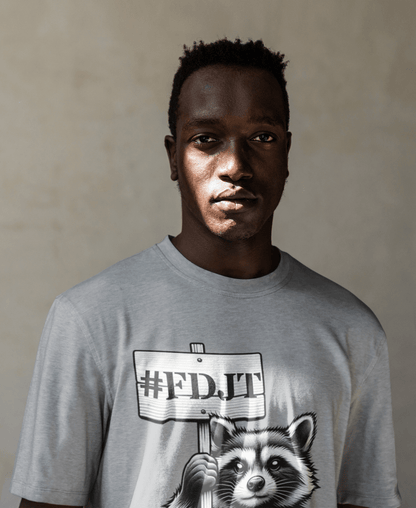 Man wearing a gray t-shirt with a graphic design of a raccoon holding a sign with '#FDJT' text.