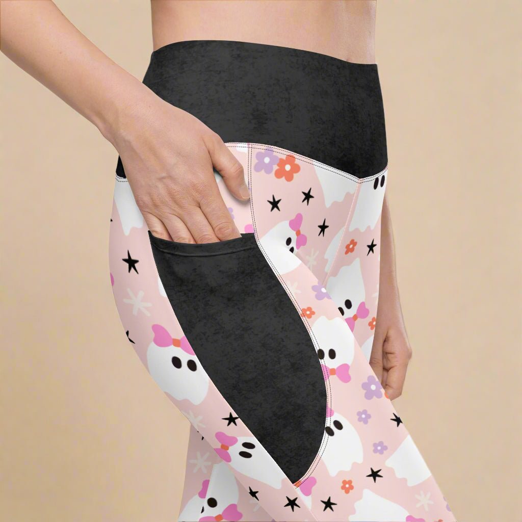 Leggings with a floral, ghost and star pattern on a white background
