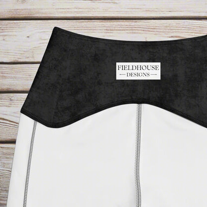 Close-up of a black waistband with 'Fieldhouse Designs' branding.