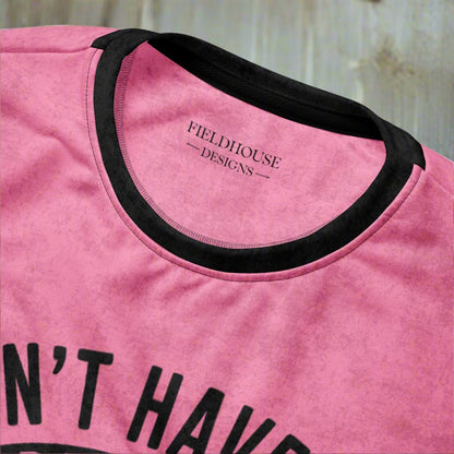 Pink t-shirt with black text and neckline, featuring 'Fieldhouse Designs' branding.