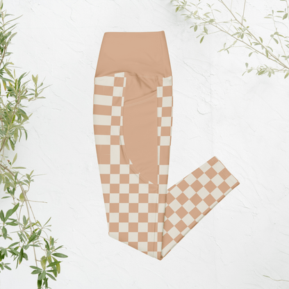 Checkered leggings with a peach and white pattern on a light background