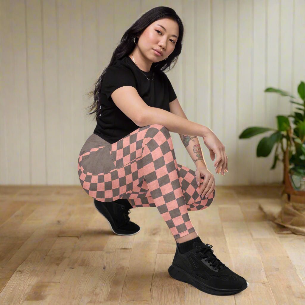 Person wearing black t-shirt and checkered pants 