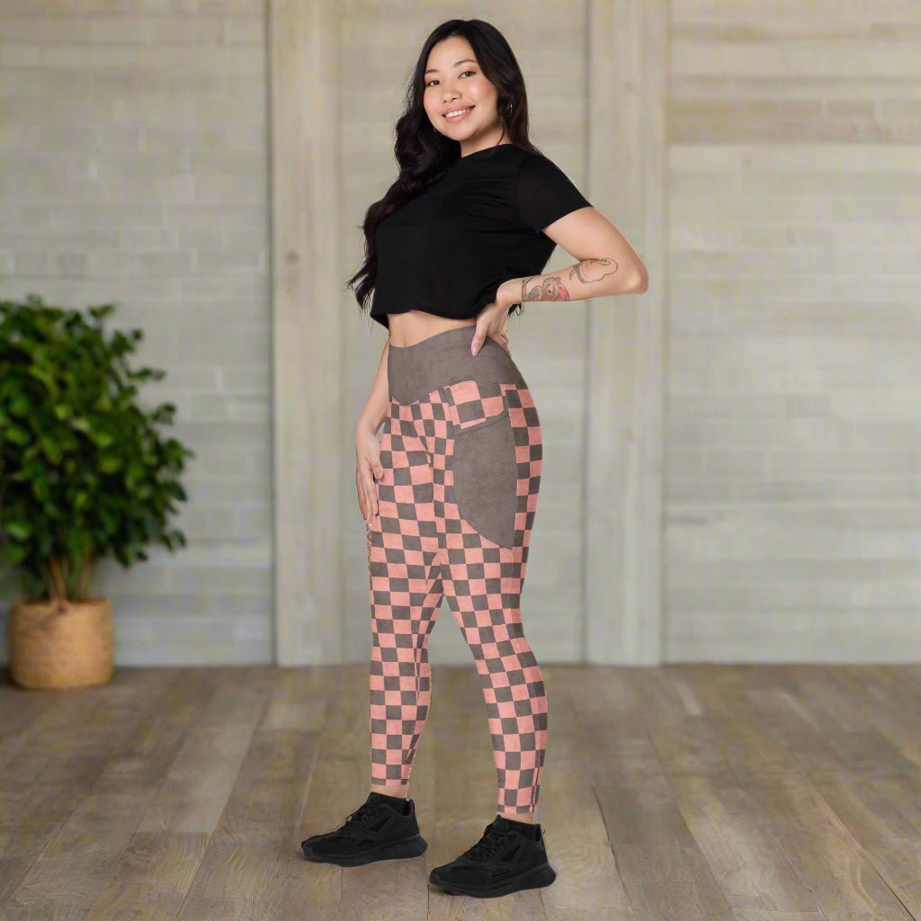 Woman wearing checkered leggings in a white background