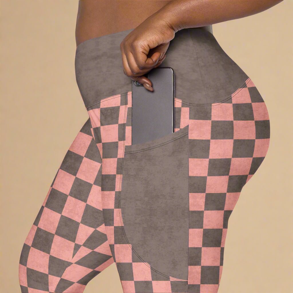 Checkered pink and brown leggings with a pocket on a beige background