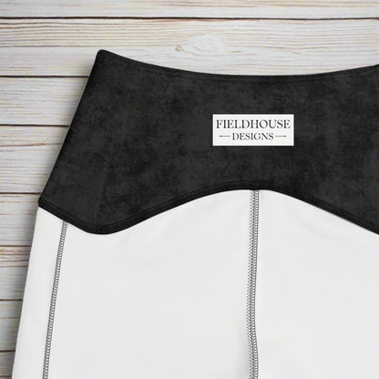 Close-up of a black waistband with 'Fieldhouse Designs' label.