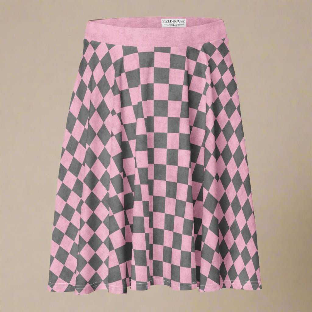 Pink and gray checkered skirt with 'Fieldhouse' label on a beige background