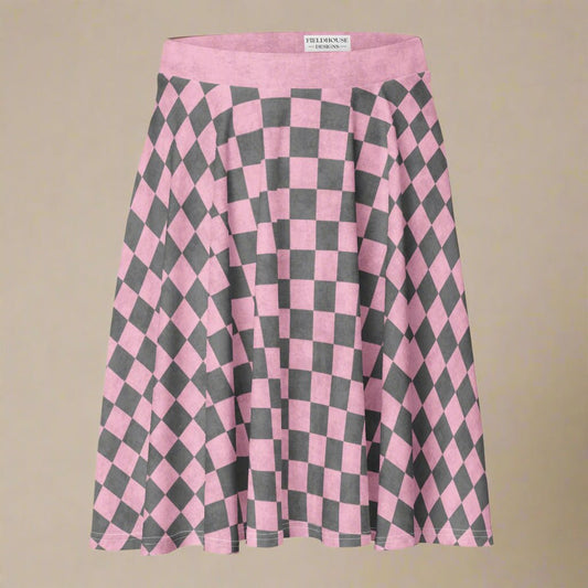 Pink and gray checkered skirt with 'Fieldhouse' label on a beige background