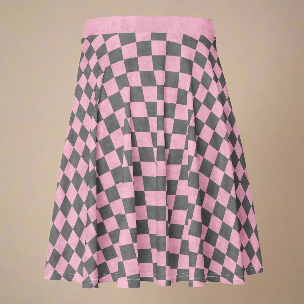 Pink and gray checkered skirt on a beige background