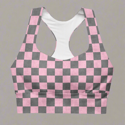 Pink and gray checkered sports bra on a gray background