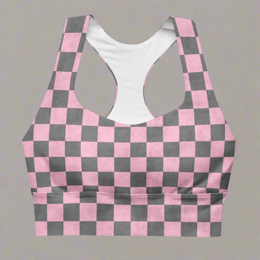 Pink and gray checkered sports bra on a gray background
