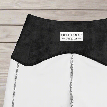 Close-up of a black waistband with 'Fieldhouse Designs' label.
