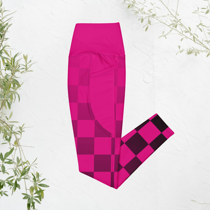 Pink checkered leggings on a white background with green leaves.