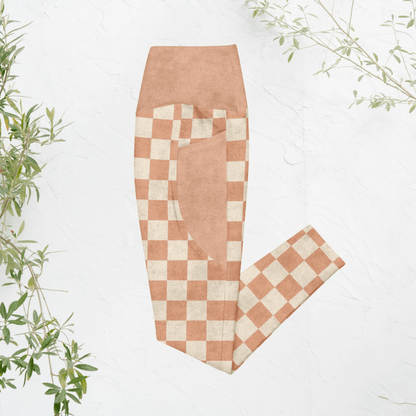 Checkered pants with a pumpkin and cream checkered pattern on a white background