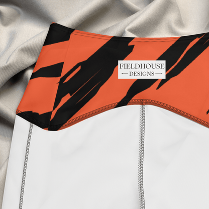 Close-up of a waistband with orange and black design, featuring 'Fieldhouse Designs' logo.