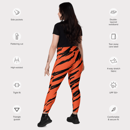 Woman wearing orange tiger stripe leggings with feature icons on a white background