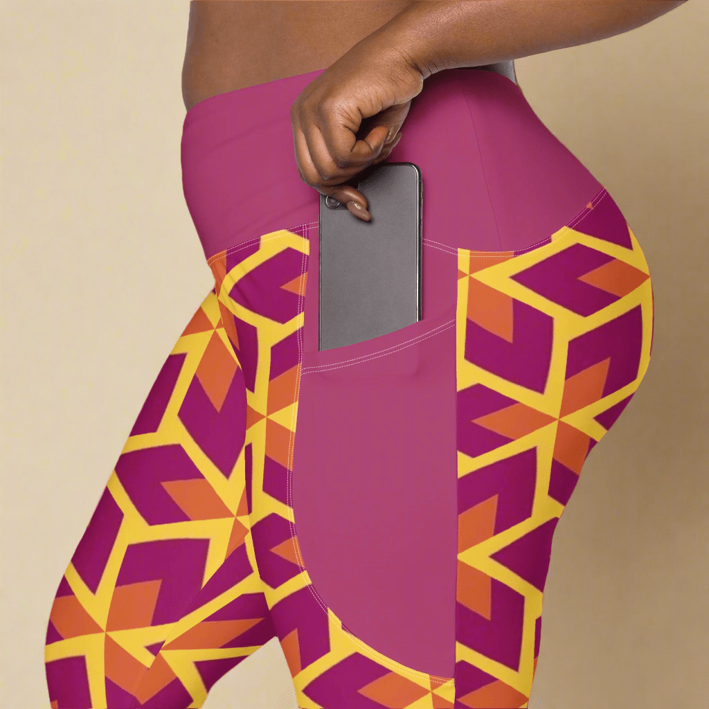Purple leggings with geometric pattern and pocket holding a phone on a beige background