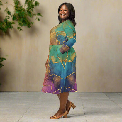 Woman wearing a rainbow dress with gold crackle pattern on a neutral background