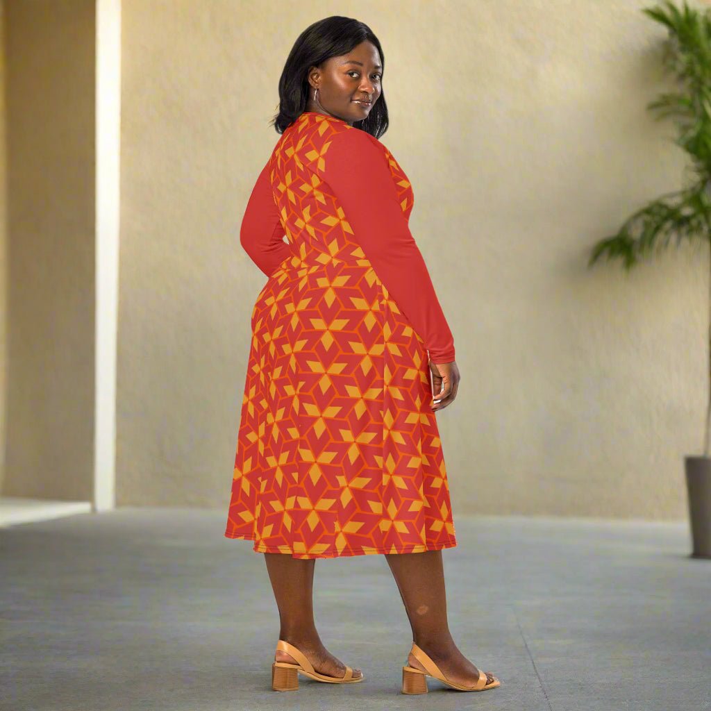 Woman wearing a red dress with yellow geometric pattern indoors
