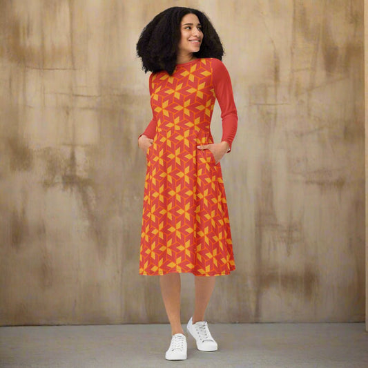 Woman wearing a red dress with yellow pattern on a white background