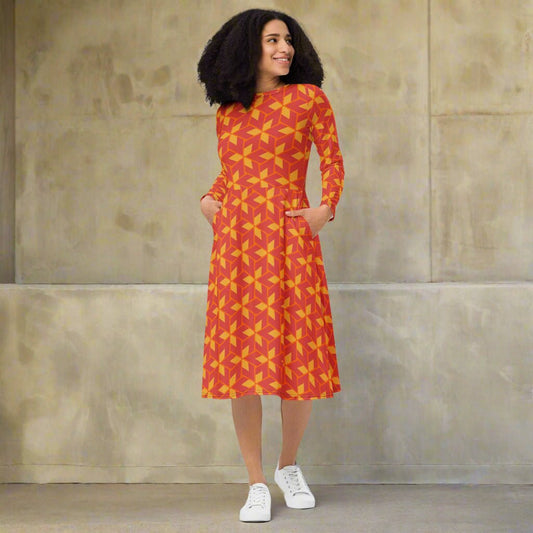Woman wearing a red and yellow patterned dress on a white background