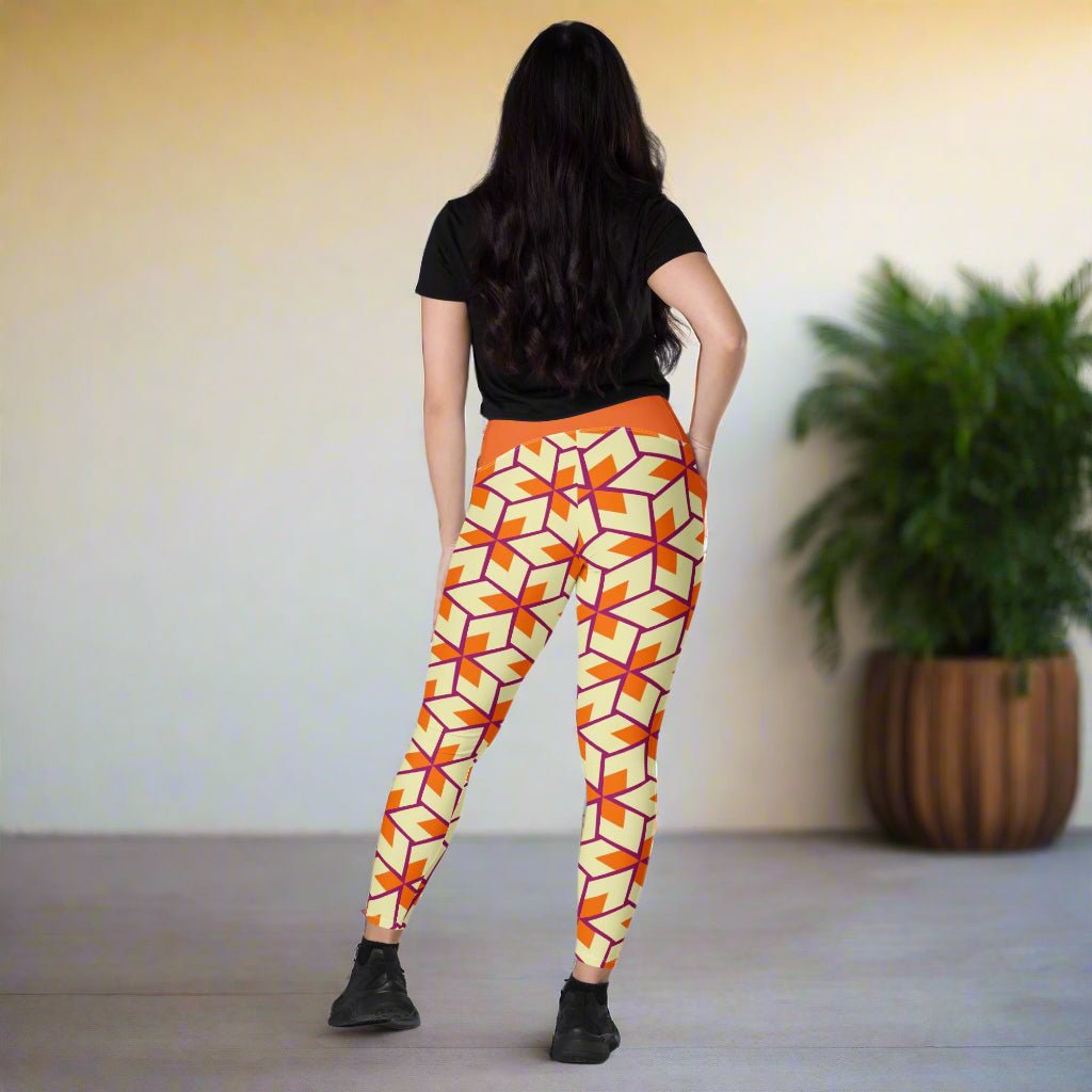 rear facing model wearing Orange Retro Geometric High-Waisted UPF 50+ Pocket Leggings 2XS–6XL | Dopamine Dressing Recycled Yoga Pants | Moisture Wicking Compression