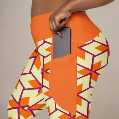 close up of model placin he phone in the pocket of her Orange Retro Geometric High-Waisted UPF 50+ Pocket Leggings 2XS–6XL | Dopamine Dressing Recycled Yoga Pants | Moisture Wicking Compression