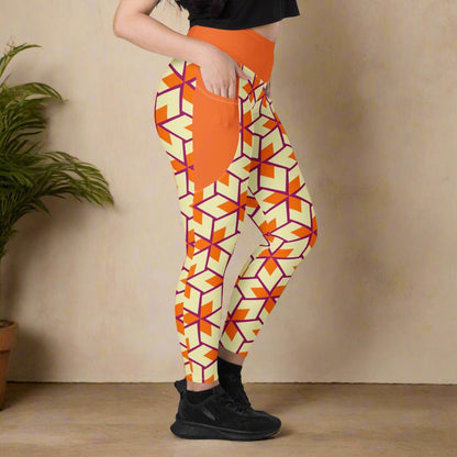 model facing the side with her hand in the pocket of her Orange Retro Geometric High-Waisted UPF 50+ Pocket Leggings 2XS–6XL | Dopamine Dressing Recycled Yoga Pants | Moisture Wicking Compression