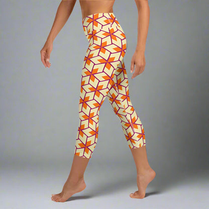 A person wearing retro geometric print yoga capri leggings with a high waistband.