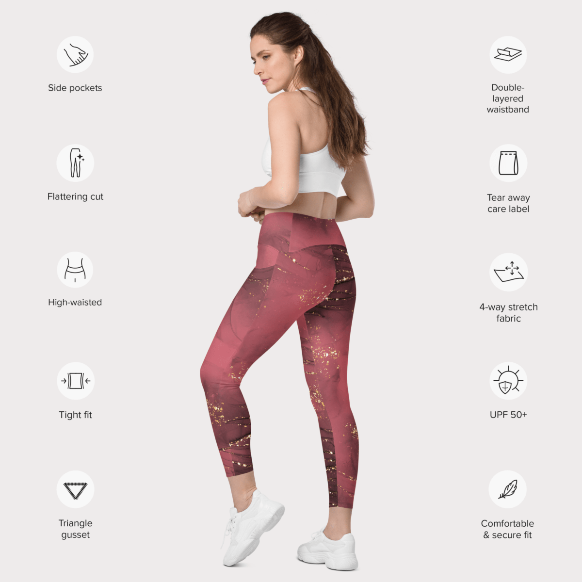 Woman wearing dusty rose marble leggings with text highlighting features on a white background