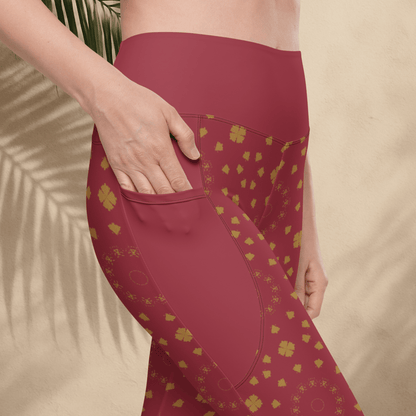 Maroon leggings with gold patterns on a beige background