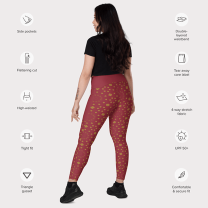 Woman wearing red patterned leggings with feature icons on a white background