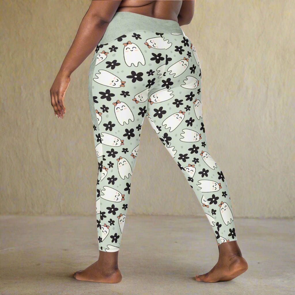Leggings with ghost and flower pattern on a light green background