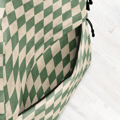 Green and beige checkered bag on a white wooden surface