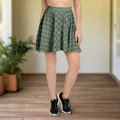 Person wearing a green checkered skirt on a wooden floor with plants in the background