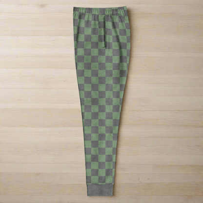 Green and gray checkered pants on a wood background