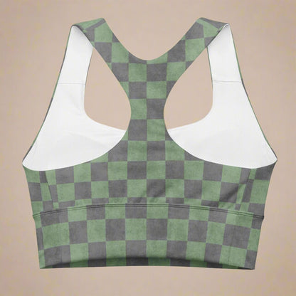 Green and gray checkered sports bra with on a beige background