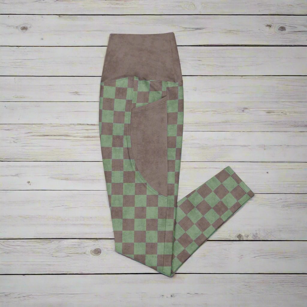Green and brown checkered pants on a wood background
