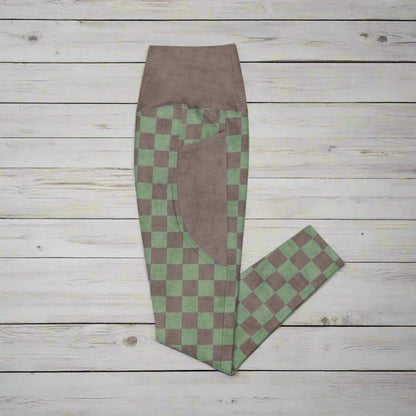 Green and brown checkered pants on a wood background