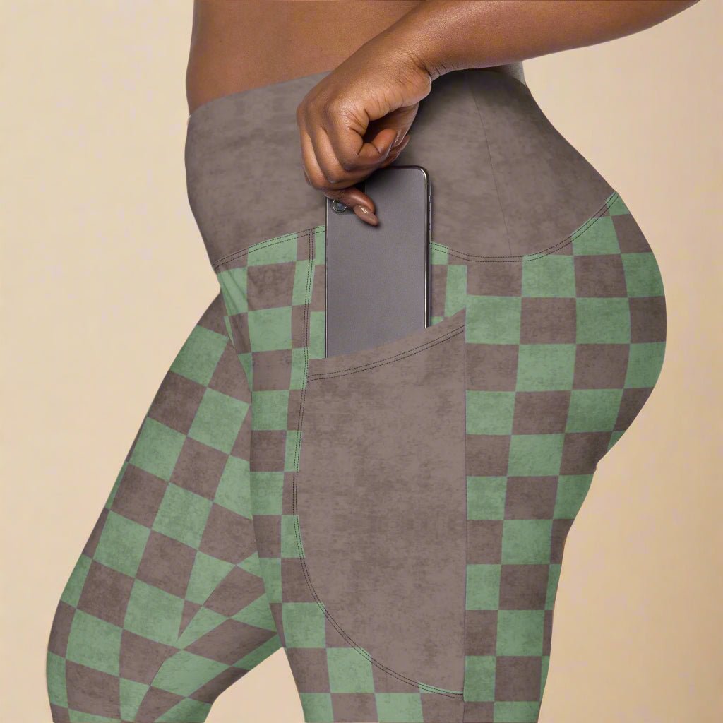 Checkered patterned leggings with a pocket on a beige background