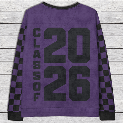 Purple sweatshirt with 'Class of 2026' text on a wooden surface