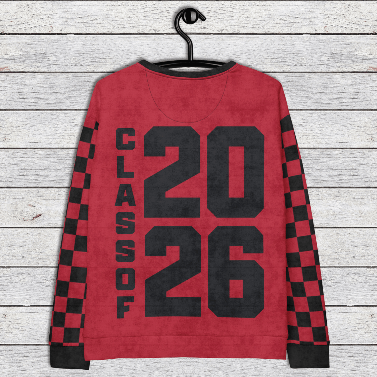 Red sweatshirt with 'Class of 2026' text on a wooden background